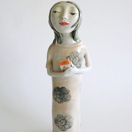 She is holding a novel